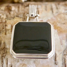Load image into Gallery viewer, Jet Pendant with Blue John on the reverse side.