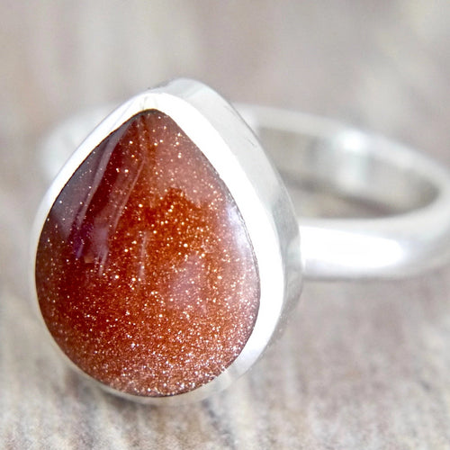 Goldstone silver ring peardrop design